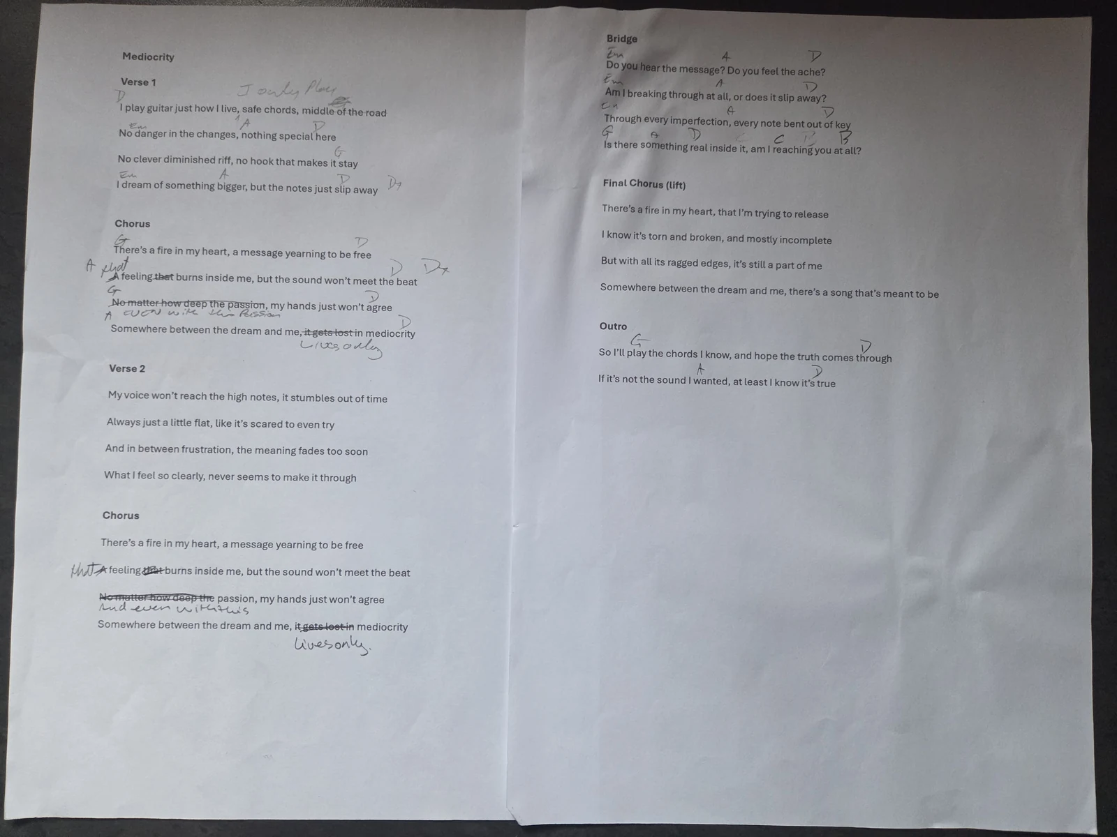 The Mediocrity working lyric sheet, with handwritten chords, crossed-out words, corrections and folds preserved.